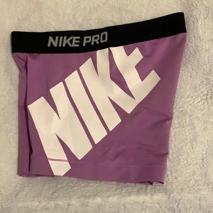 Nike Pro shorts black and purple woman’s size M